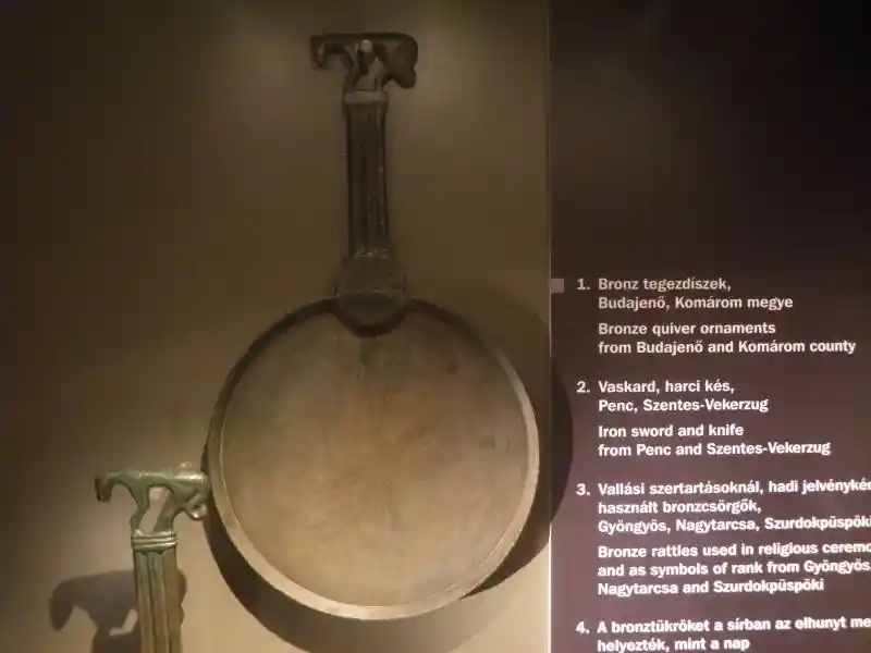 Bronze mirror, a solar symbol with an animal on the handle